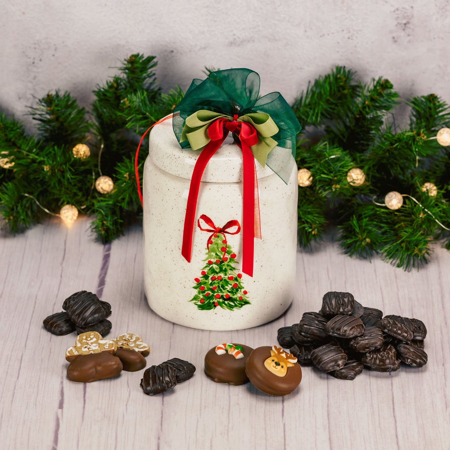a ceramic hand painted tree cookie jar is filled with some of Marie's sweet cookies like Mint Mint cookies, Oreos, and gingerbread men.