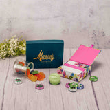  a half pound box of assorted chocolates, 1/4 lb. milk chocolate foil wrapped violets, 1/2 lb. awesome blossom gummies, and a mint oreo packaged with a peony print notecard box