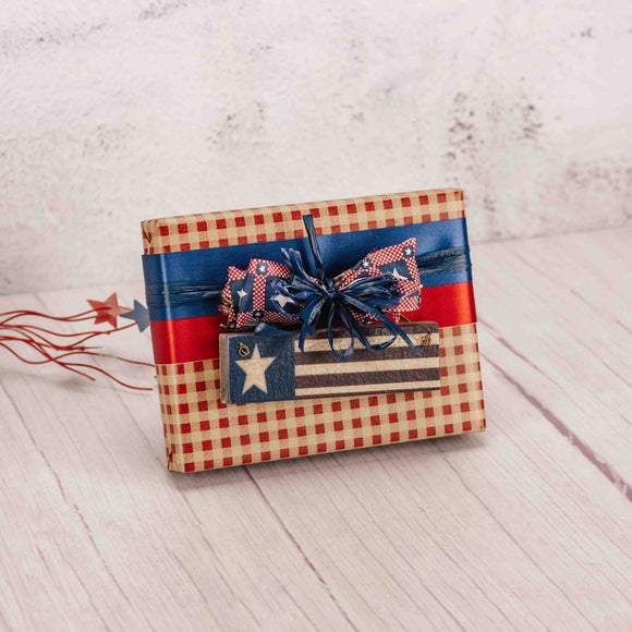 half pound box of assorted chocolates with a wooden flag ornament on top