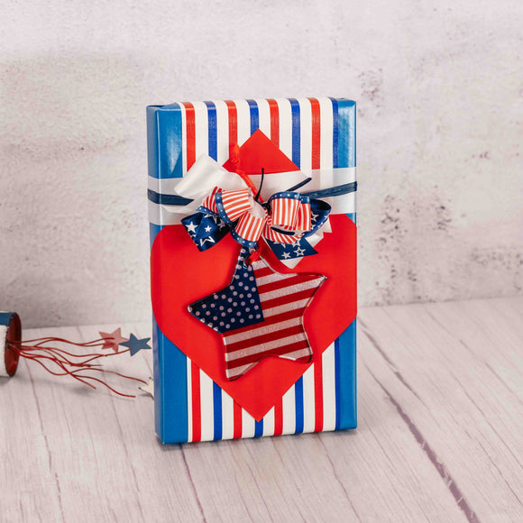 Indulge in the perfect patriotic treat with our Star One Pound gift box. Made with exquisite Assorted Chocolates, this stunning box is wrapped in red, white, and blue and topped with a unique glass star-shaped flag ornament. Celebrate America this summer in style. Assorted star designs.