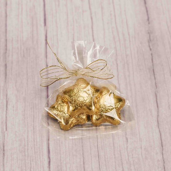 three milk chocolate gold foil stars tied in a bag