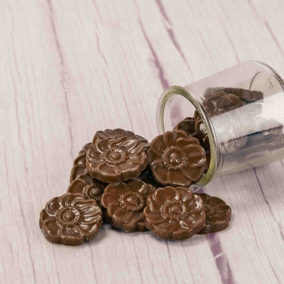 half pound of smooth milk chocolate pieces in flower blossom shape