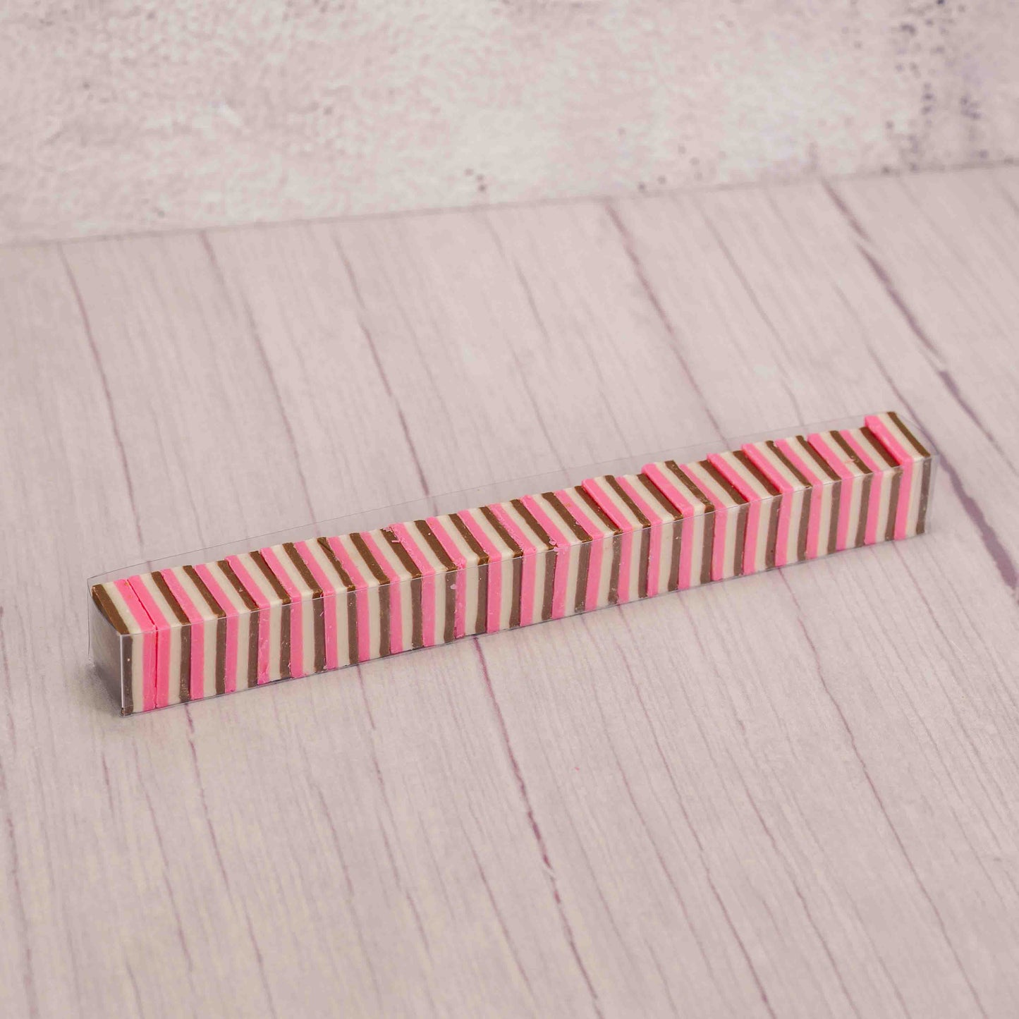 half pound sleeve of milk chocolate, white and pink wafers reflecting the flavors of Neapolitan ice cream!