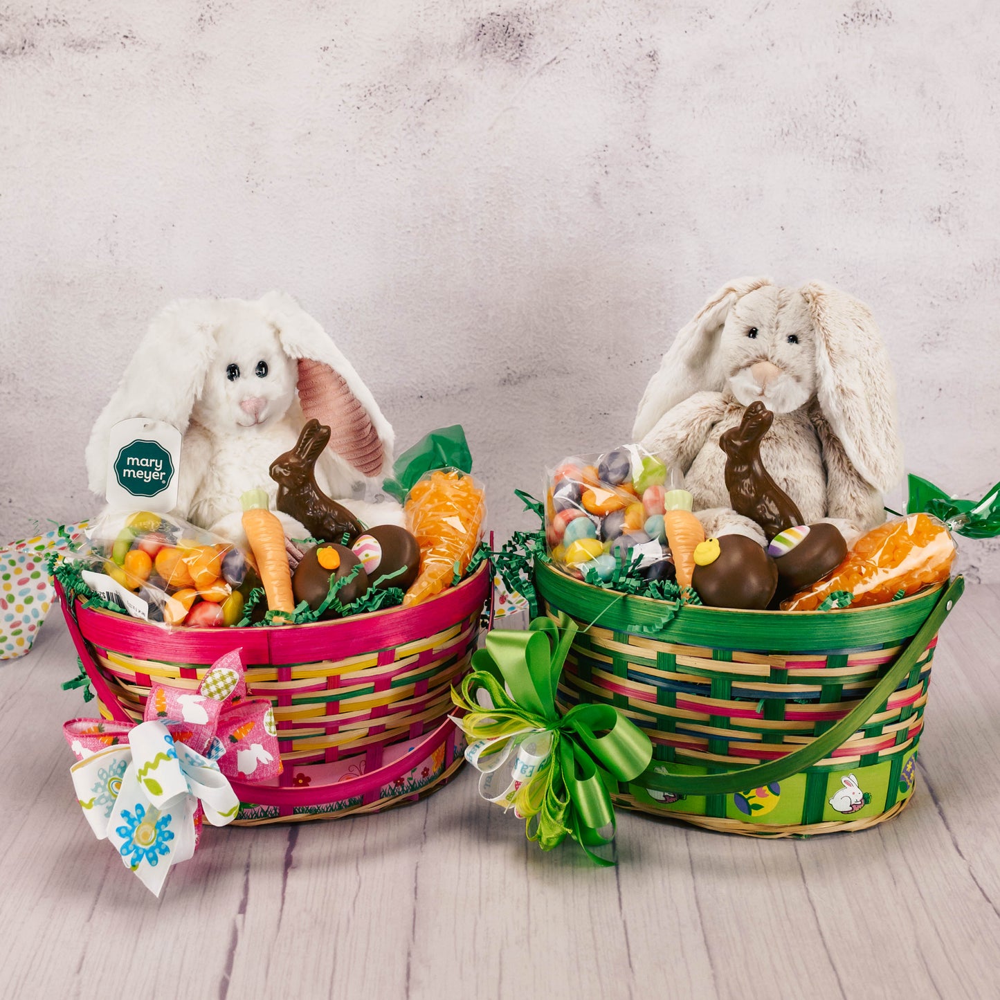 a colorful Easter basket filled with candy and a stuffed plush bunny rabbit. Choose a boy or girl themed basket