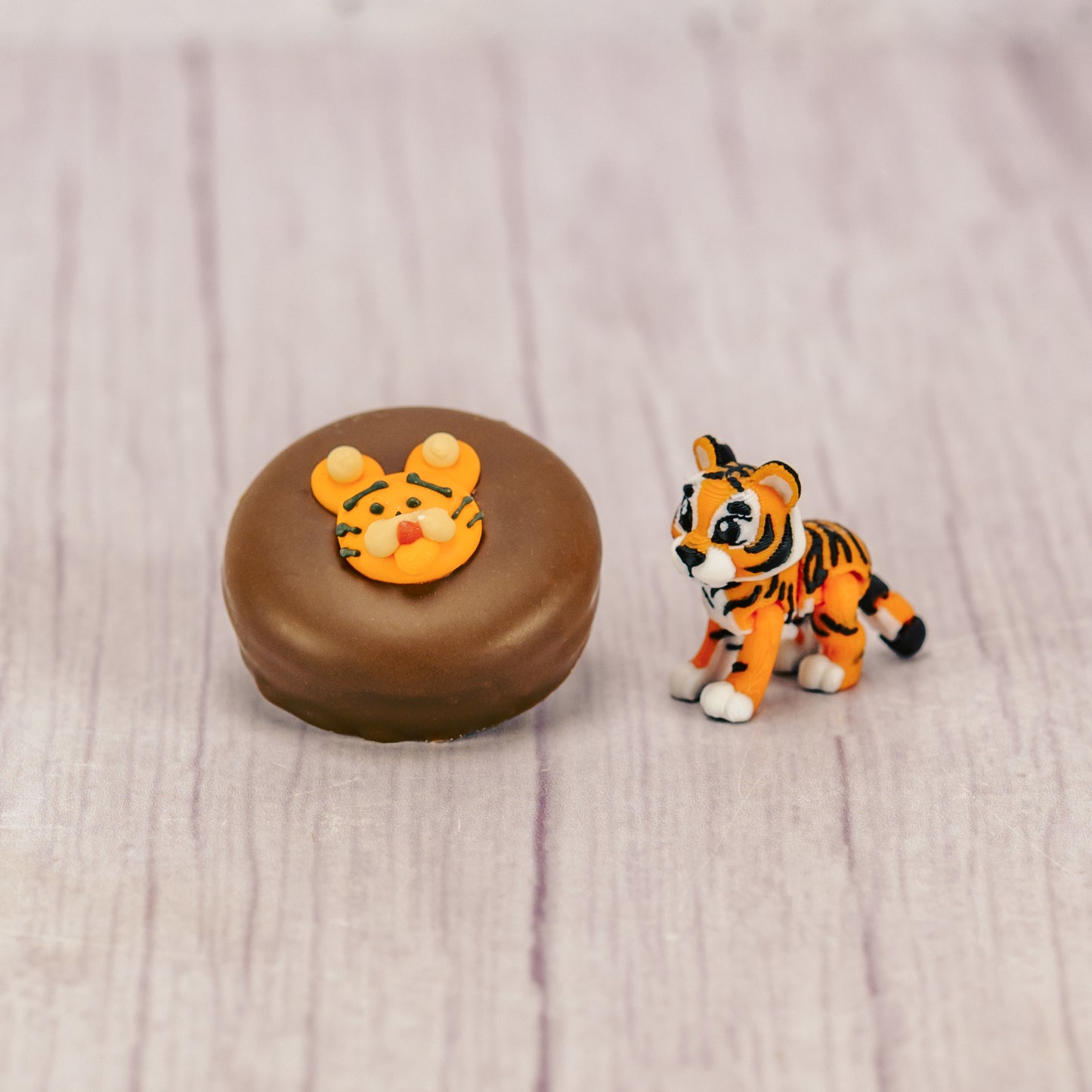 Here's a fun and unique memento for the tiger graduate or teacher, a 3-D printed wiglidtz tiger toy packed with a delicious Tiger Oreo. Simple, yet memorable and fun!