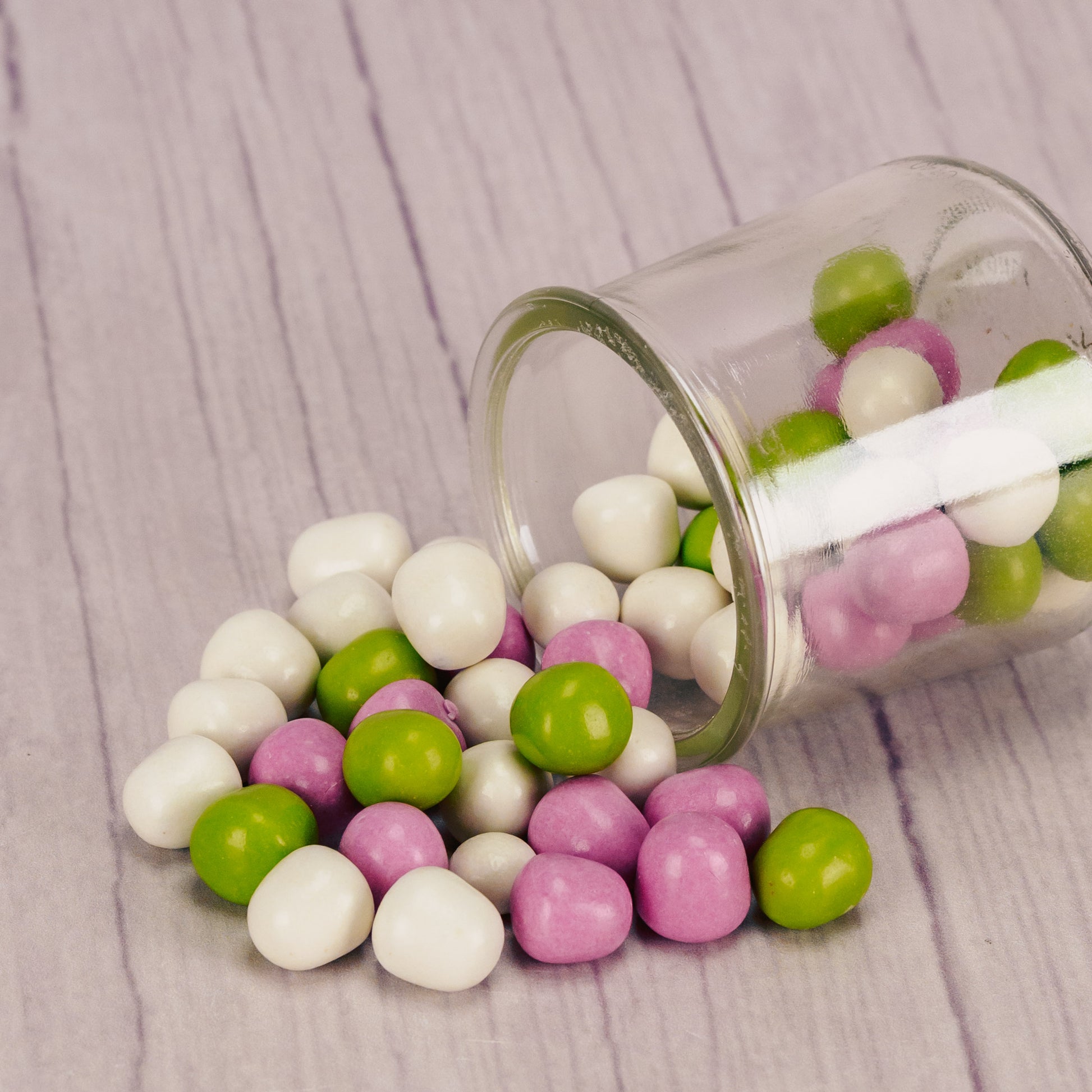 Creamy peppermint coated in a chocolate shell, finished in pastel colors with a satin look. These are a perfect addition to wedding tables and special events! Approximately 105 pieces per half pound