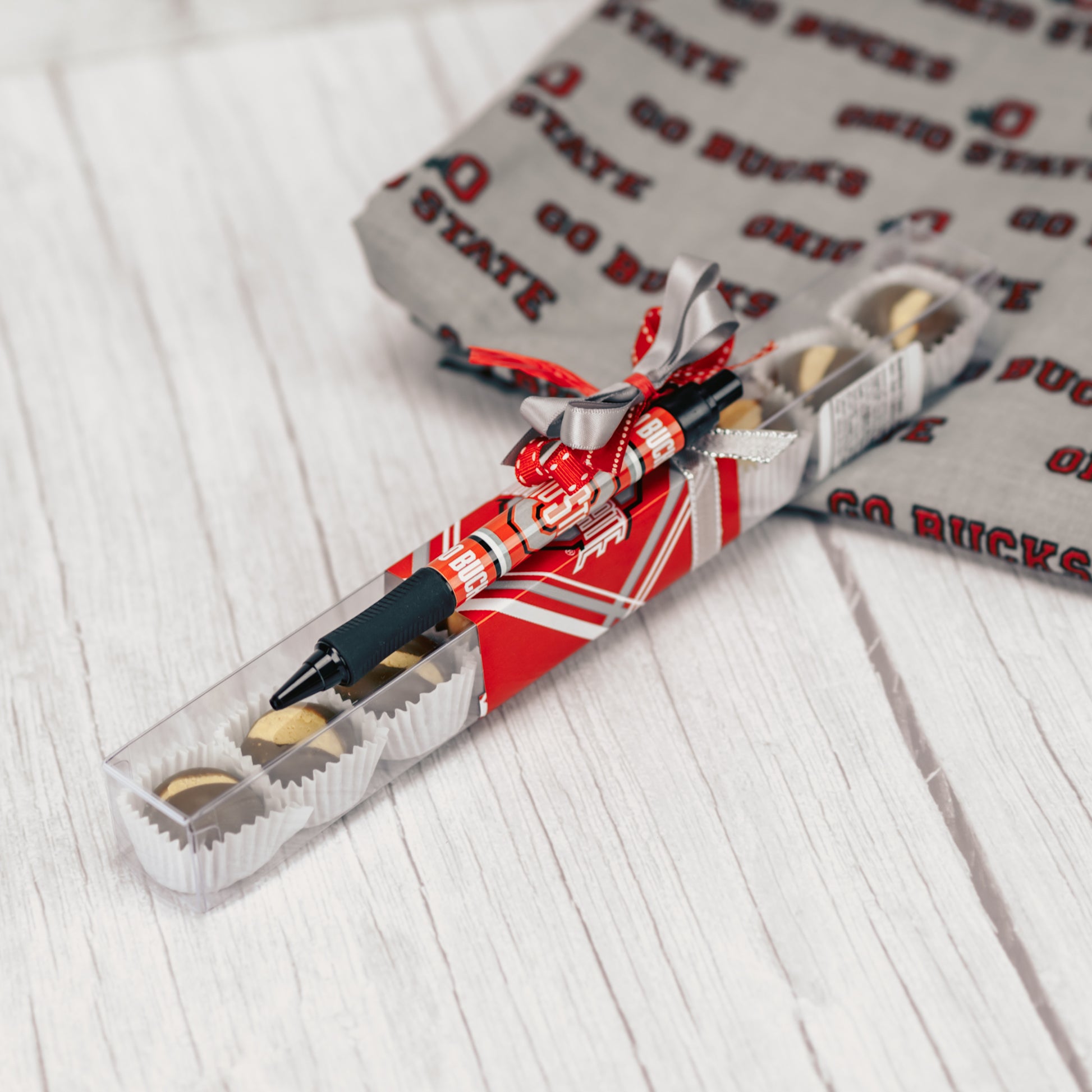 a quarter pound box of our Buckeyes is topped with an Ohio State Pen