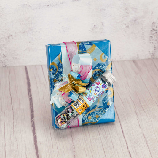 a half pound box of assorted milk and dark chocolates is wrapped and topped with a 150 mini piece menorah puzzle.