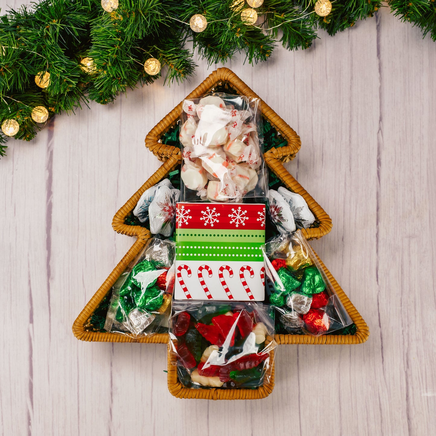 a wicker tree shaped basket is filled with over a pound and a half of candies.