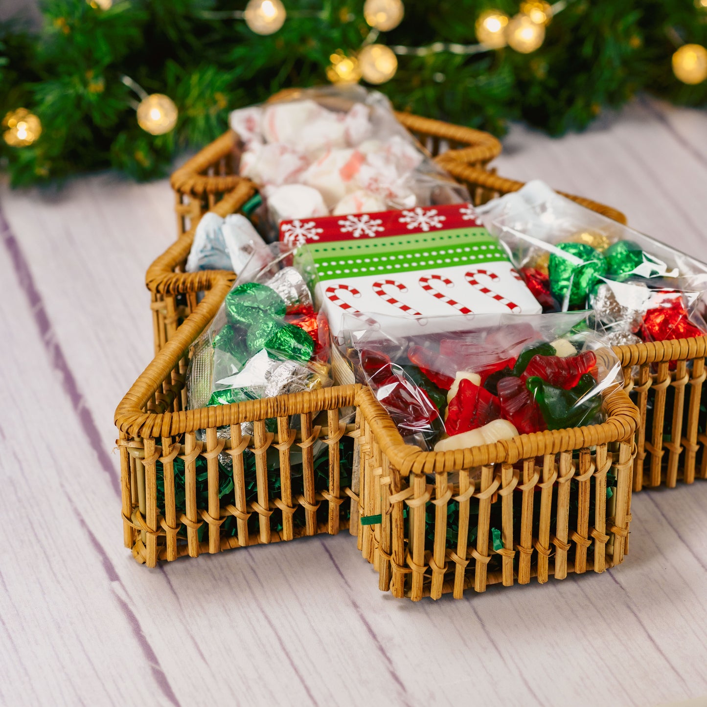 a wicker tree shaped basket is filled with over a pound and a half of candies.