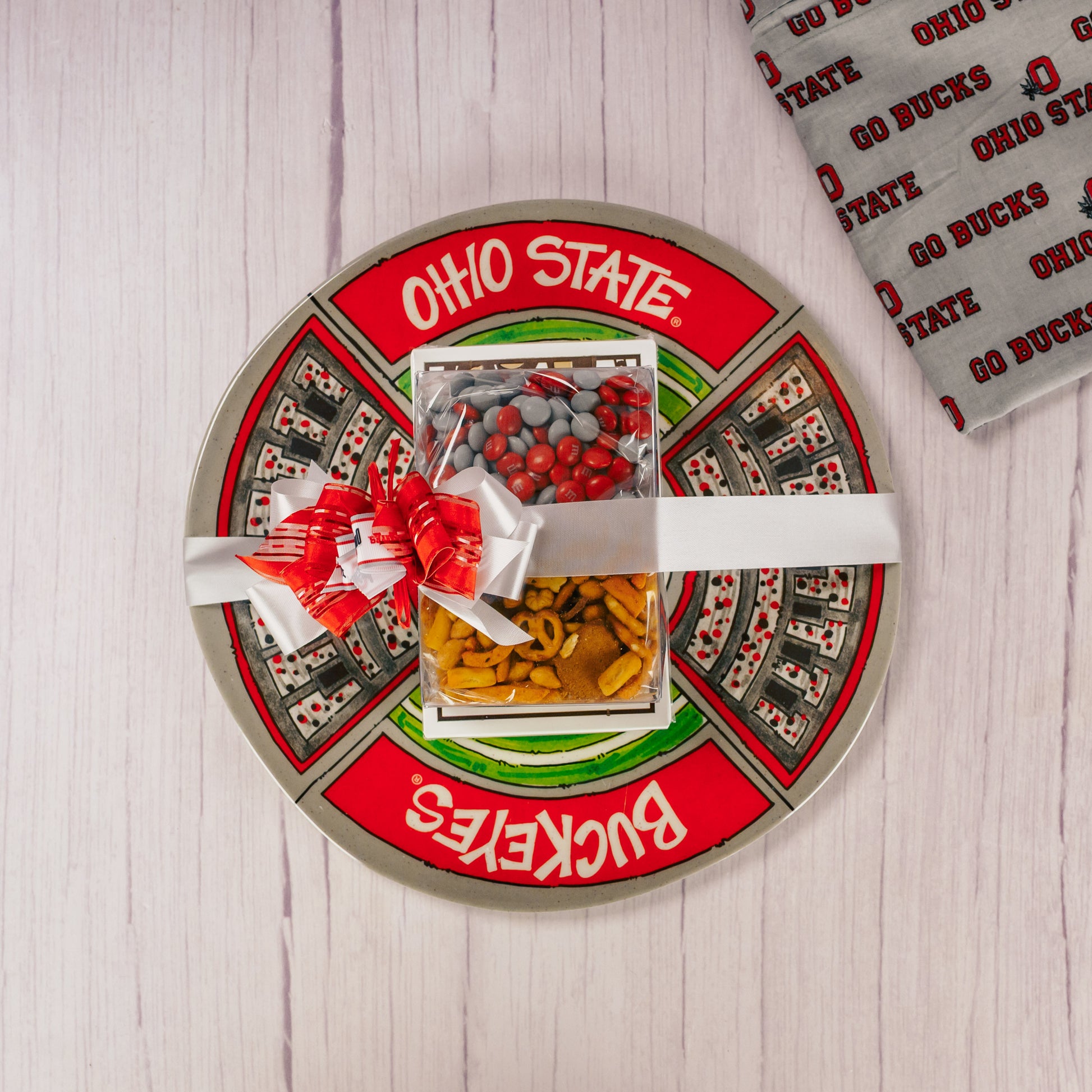 a round melamine Ohio State platter is packaged with some sweet treats!