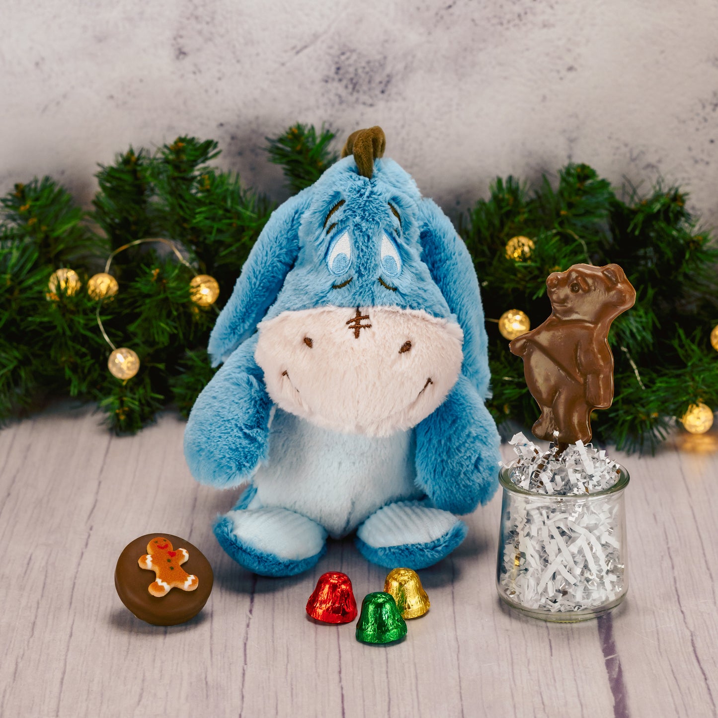 Eeyore plush with a bag of sweet treats