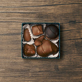 Seven mouthwatering pieces of Marie's chocolates, including at least one dark chocolate piece, as well as, our famous Tur'Kin (like a Turtle) and Peppermint Chew (one of Marie's first recipes).