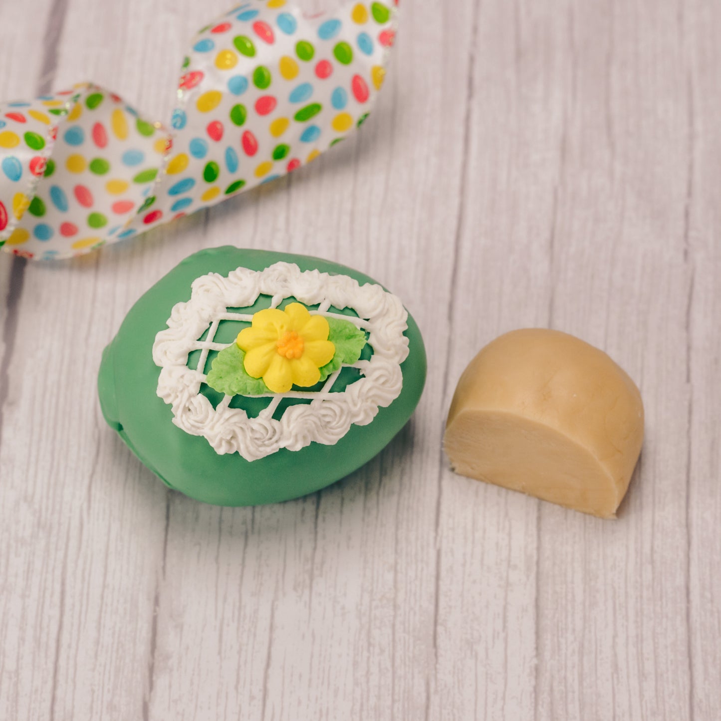 Butter cream and cream fondant center formed in egg shape covered in milk chocolate or green coating in various sizes.