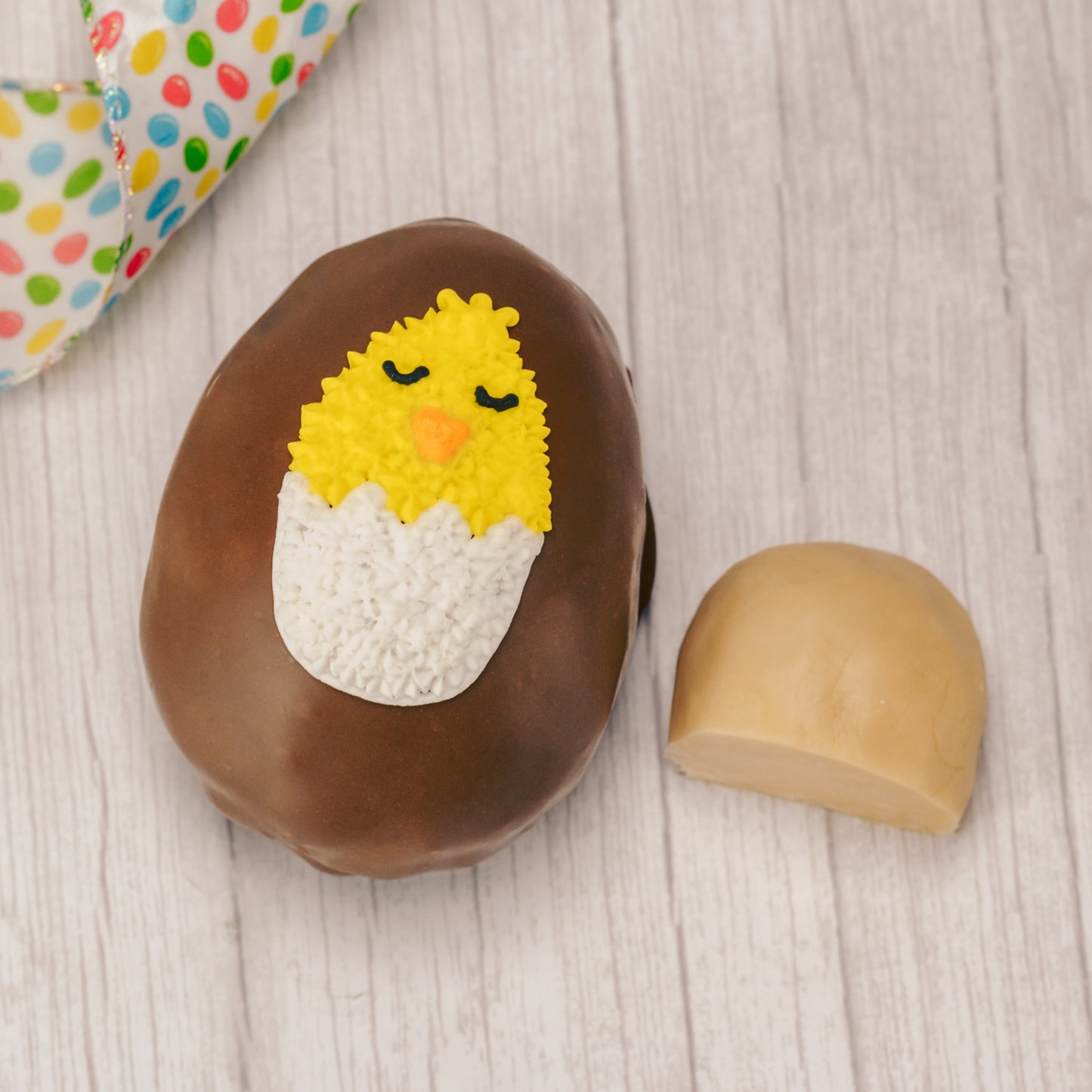 Butter cream and cream fondant center formed in egg shape covered in milk chocolate or green coating in various sizes.