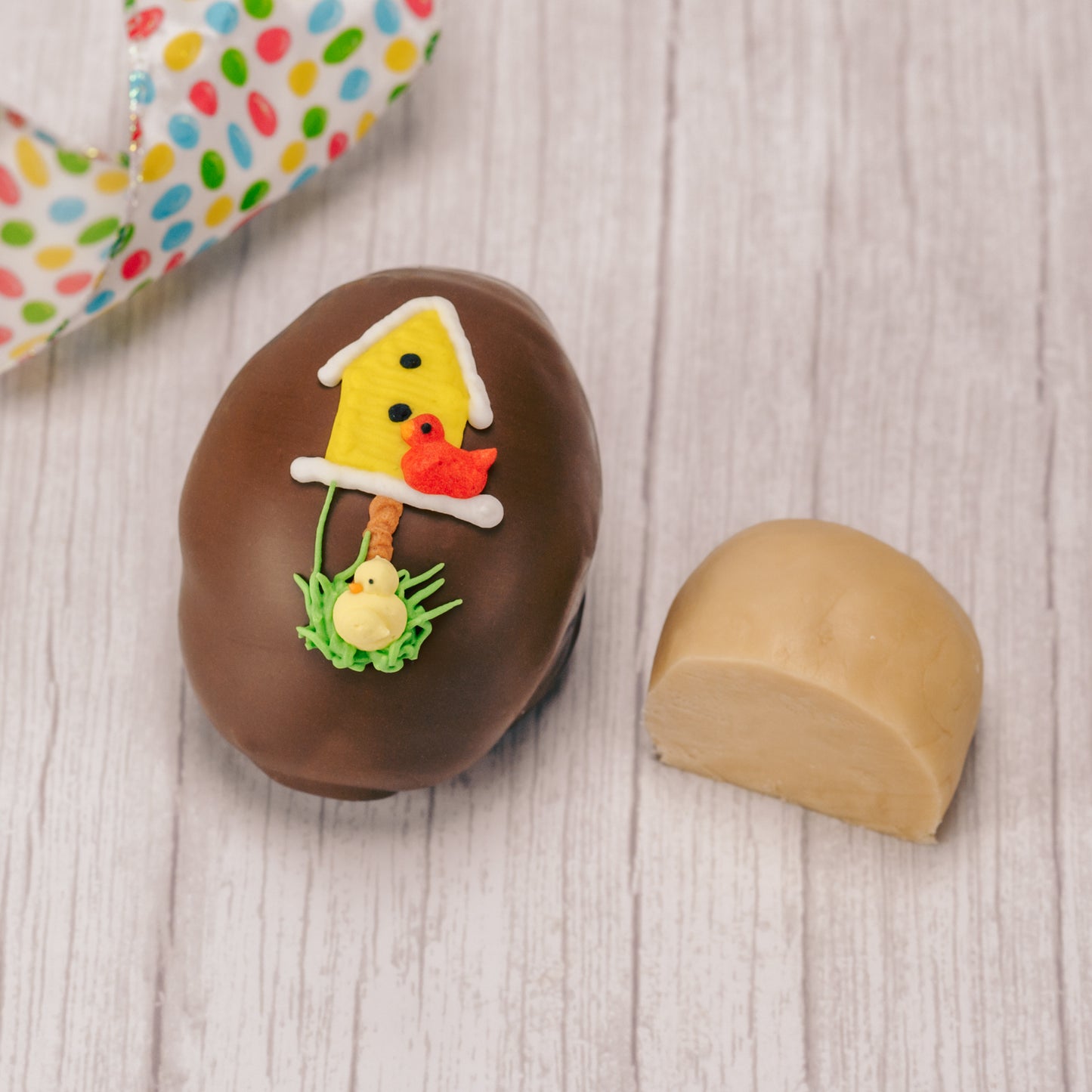 Butter cream and cream fondant center formed in egg shape covered in milk chocolate or green coating in various sizes.
