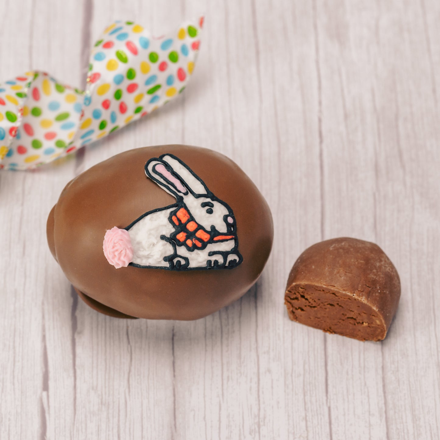 This egg has a rich fudgy chocolate center and is covered in milk or dark chocolate. Assorted sugar and icing decorations, choose a quarter pound, half pound or one pound egg.