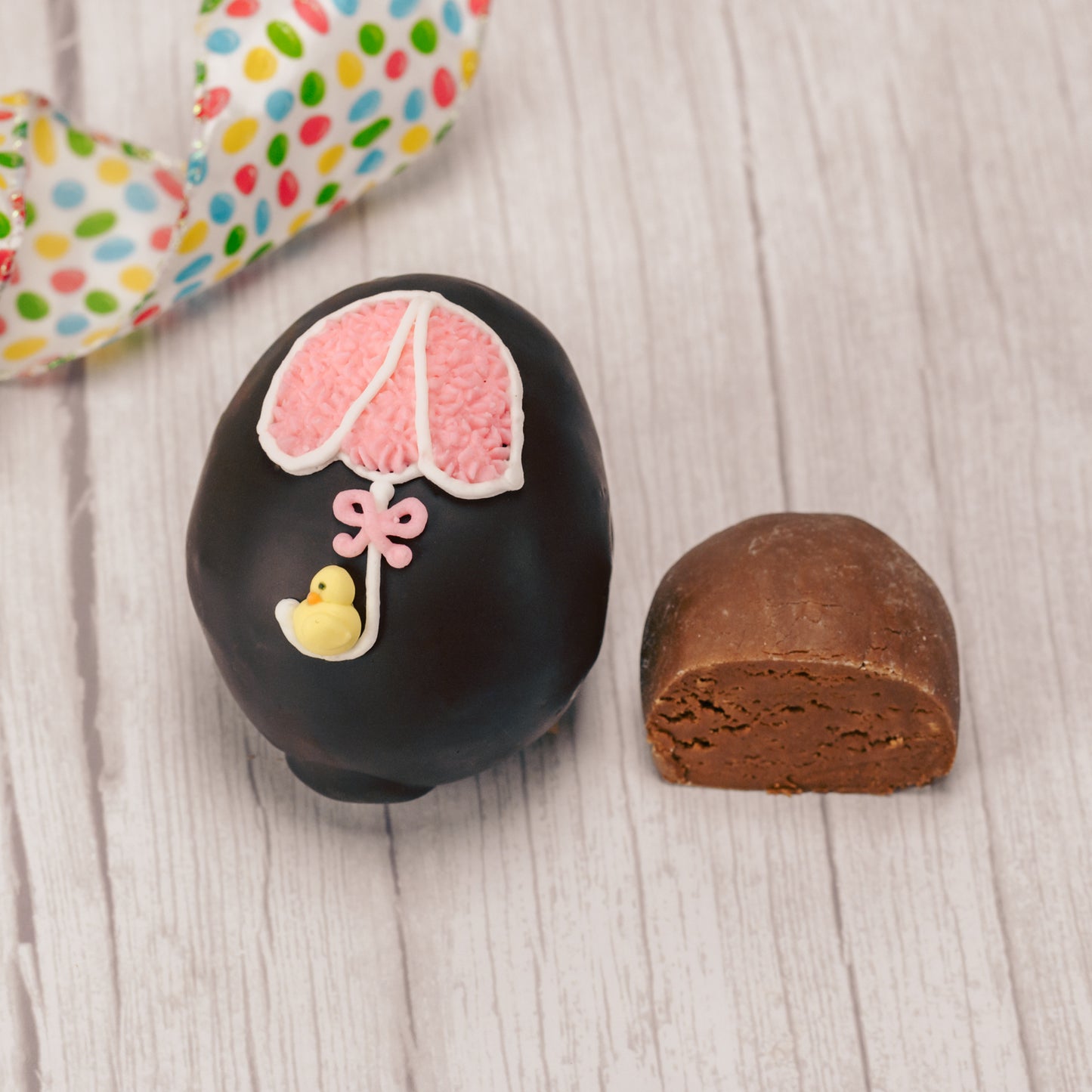 This egg has a rich fudgy chocolate center and is covered in milk or dark chocolate. Assorted sugar and icing decorations, choose a quarter pound, half pound or one pound egg.