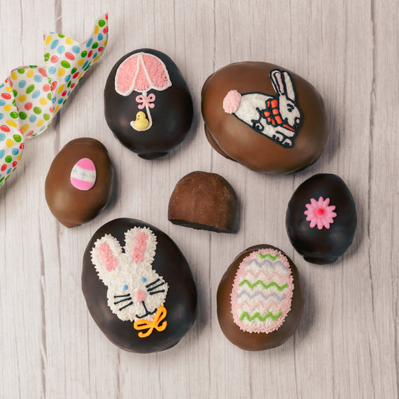This egg has a rich fudgy chocolate center and is covered in milk or dark chocolate. Assorted sugar and icing decorations, choose a quarter pound, half pound or one pound egg.