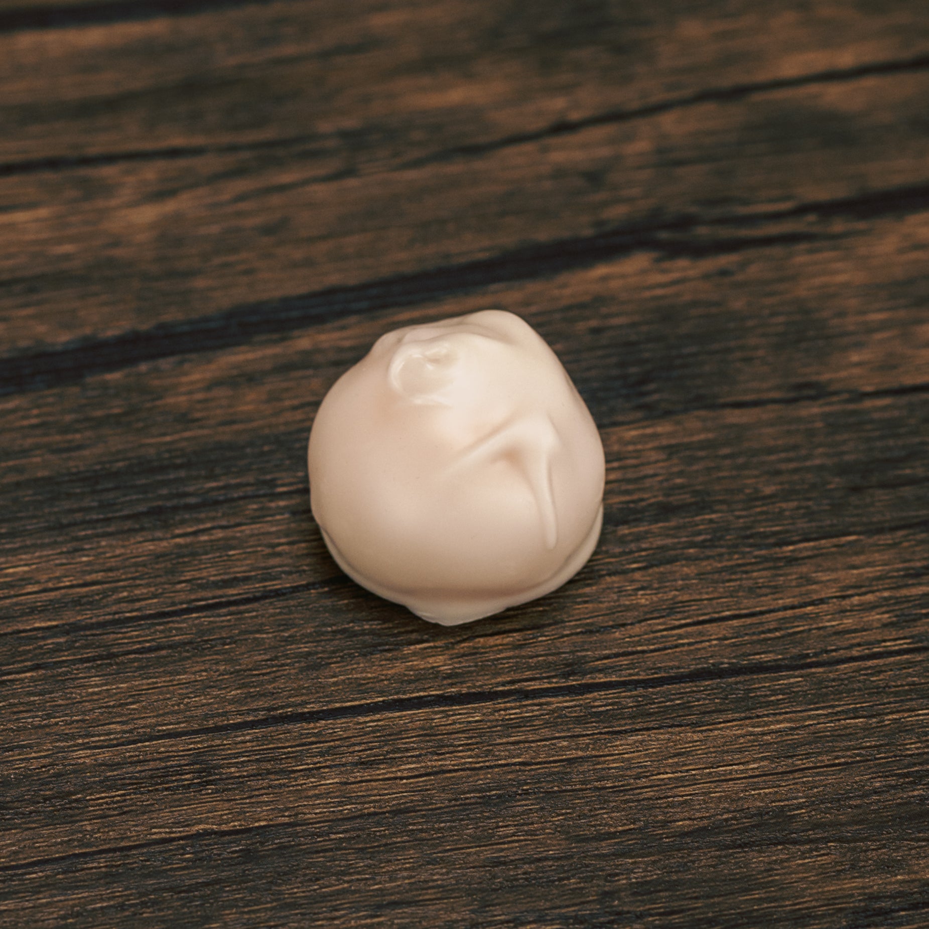 A luscious tangy orange cream center dipped in sweet white coating - a treat only available during the summer.