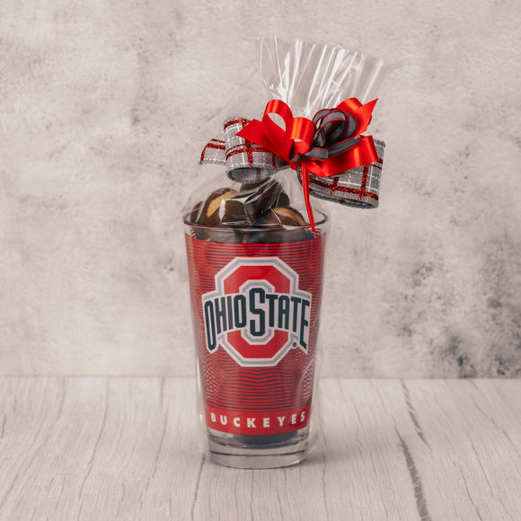 a Big Gulp amount - over a half pound - of our divine Buckeyes is filled in this red Ohio State glass cup, that has the block O on one side and Brutus on the other side. 