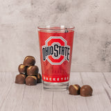 a Big Gulp amount - over a half pound - of our divine Buckeyes is filled in this red Ohio State glass cup, that has the block O on one side and Brutus on the other side.