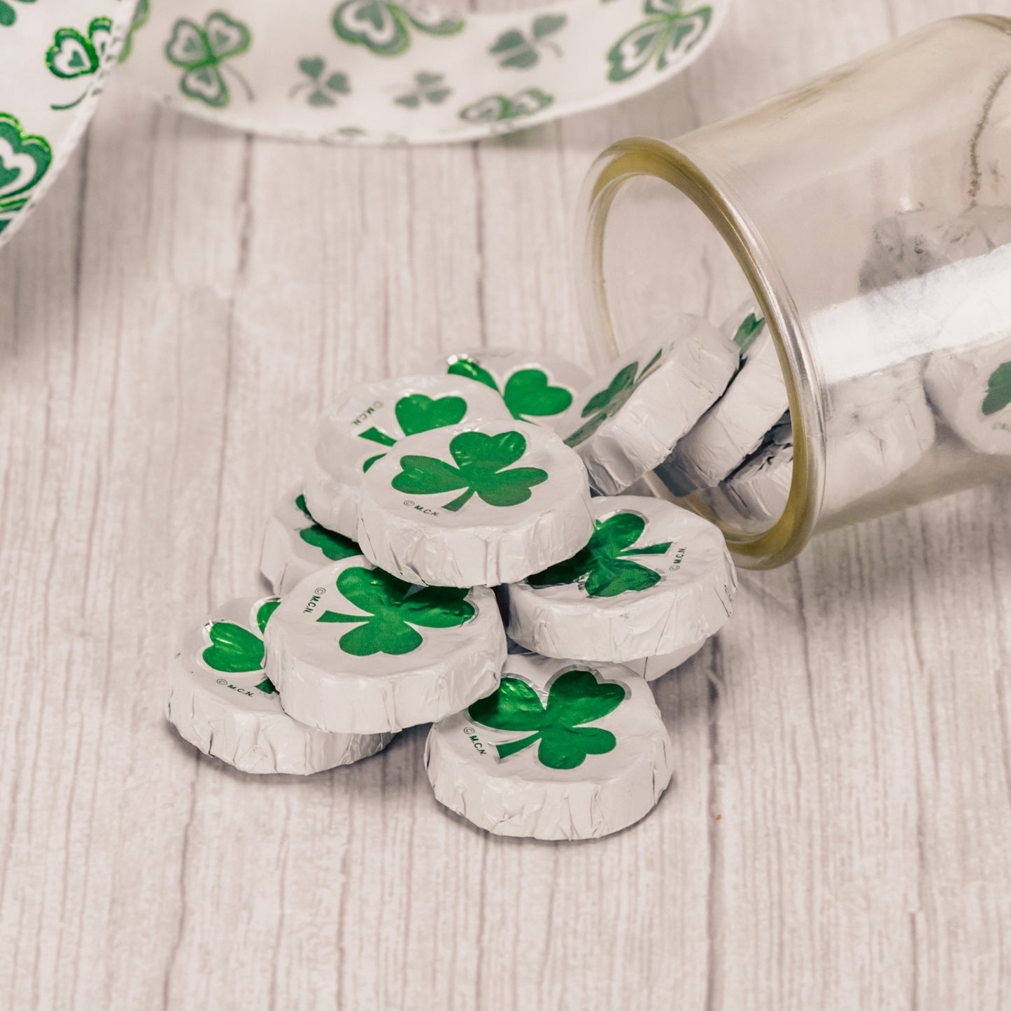 a half pound bag of milk chocolates wrapped in shamrock foil.