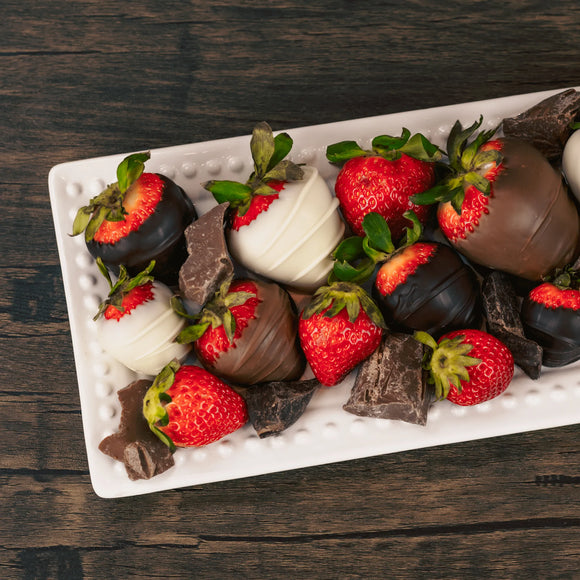 A one pound box of Milk and Dark Chocolate covered strawberries, as well as, white coating (tastes like white chocolate)