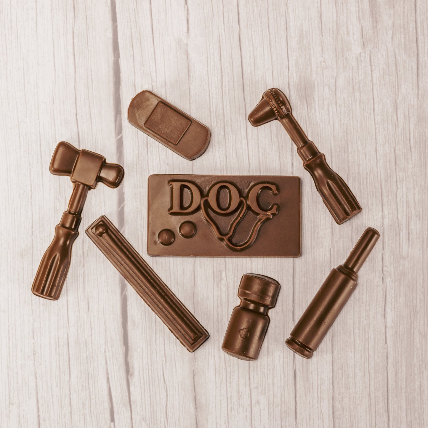 milk chocolate doctor tools and instruments in a box