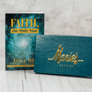 a one pound assortment box paired with the book about Marie starting her business, "Faith, the Only Star"