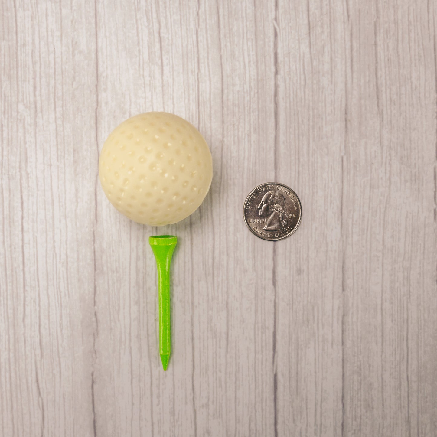 Solid white coating golf ball packaged with a real golf tee.
