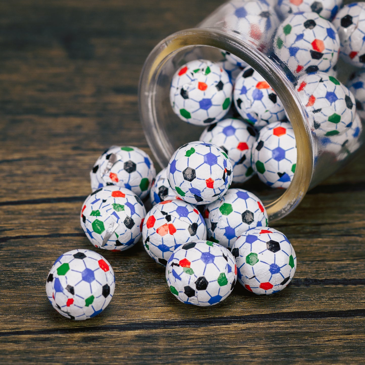bite size milk chocolate balls wrapped in soccer ball foil in a half pound bag.