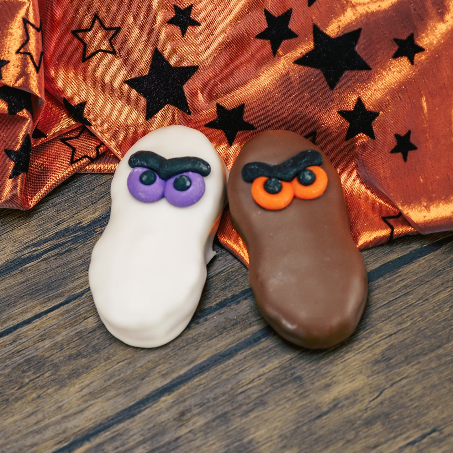 A Nutter Butter Cookie dipped in white coating or milk chocolate with a set of sugar eyes