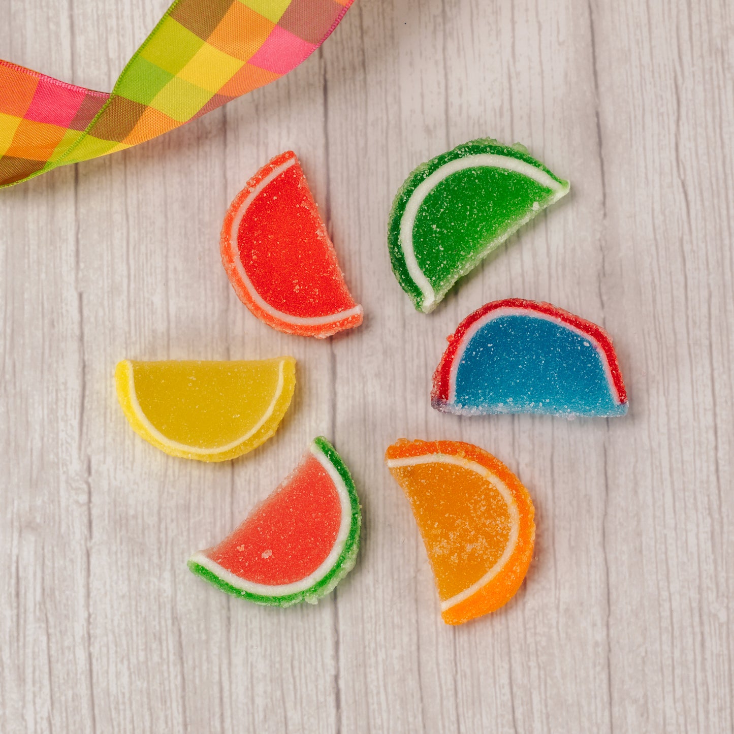 chewy, gummi sugar-coated fruit slices include blue raspberry, lemon, lime, orange, cherry and watermelon. Come two of each flavor in a package.