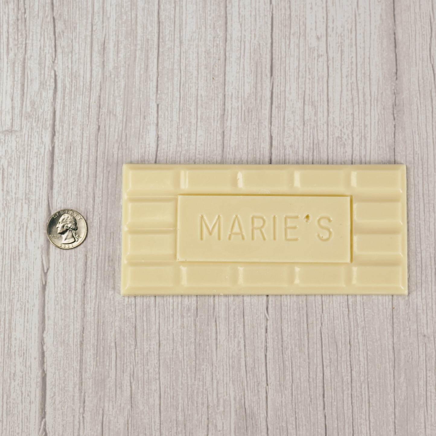 white coating molded into a bar that says "Marie's"