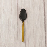 A plastic spoon dipped in dark chocolate. Individually wrapped.
