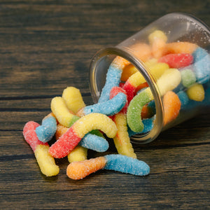 These mini neon colored gummi worms are sure to make you pucker! Dusted in sour sugar, the flavors include blue raspberry, lemon, orange, cherry, and green apple.