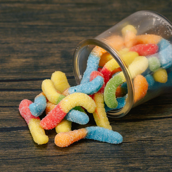 These mini neon colored gummi worms are sure to make you pucker! Dusted in sour sugar, the flavors include blue raspberry, lemon, orange, cherry, and green apple.