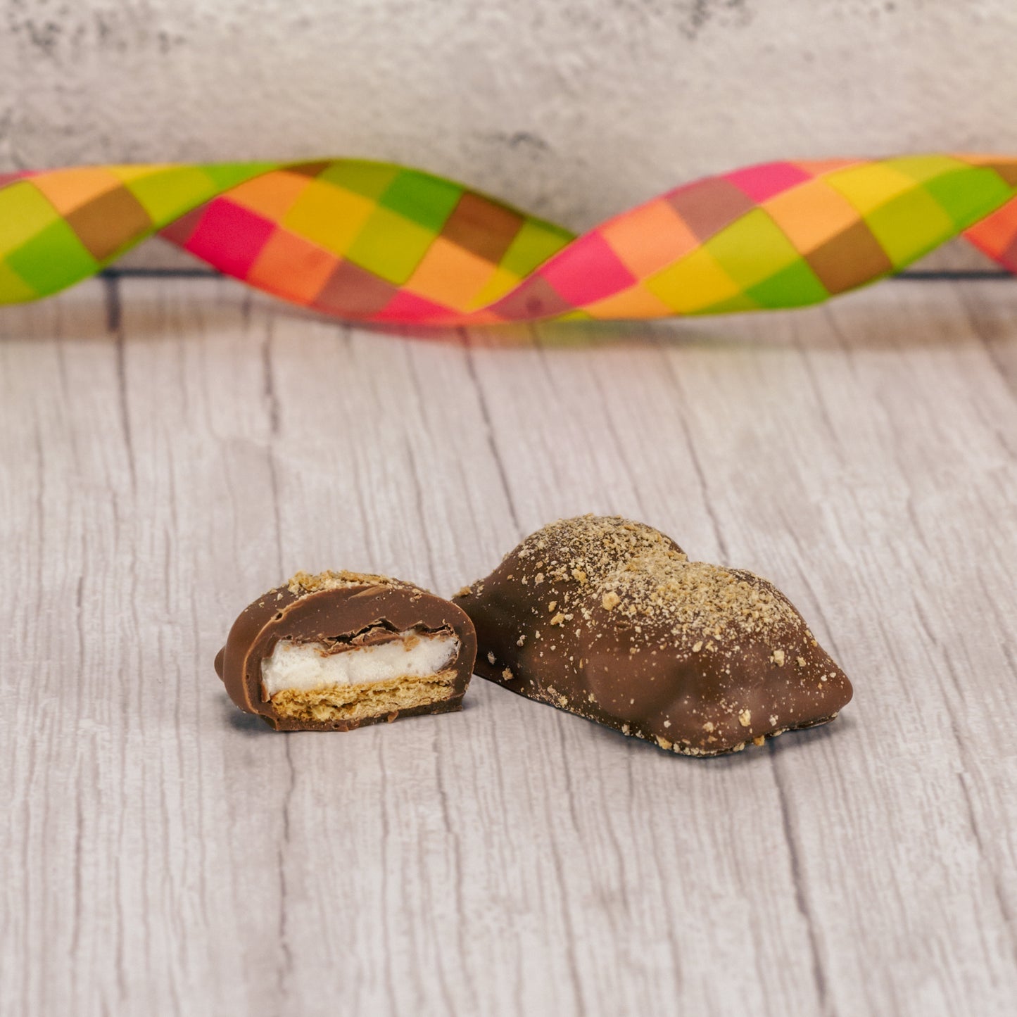 Individually packaged. Graham cracker on the bottom with marshmallows on top and covered with smooth milk chocolate, topped with crushed graham cracker crumbs.