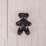 Solid dark chocolate teddy bear.