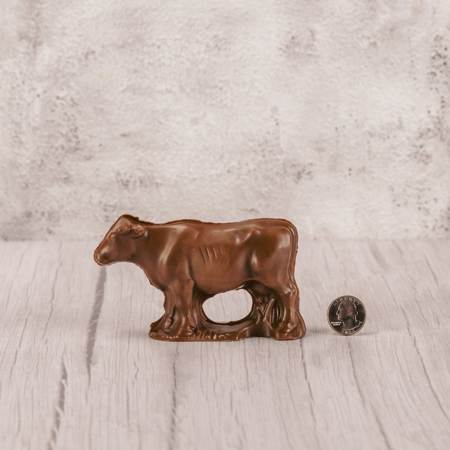 a standing solid milk chocolate cow