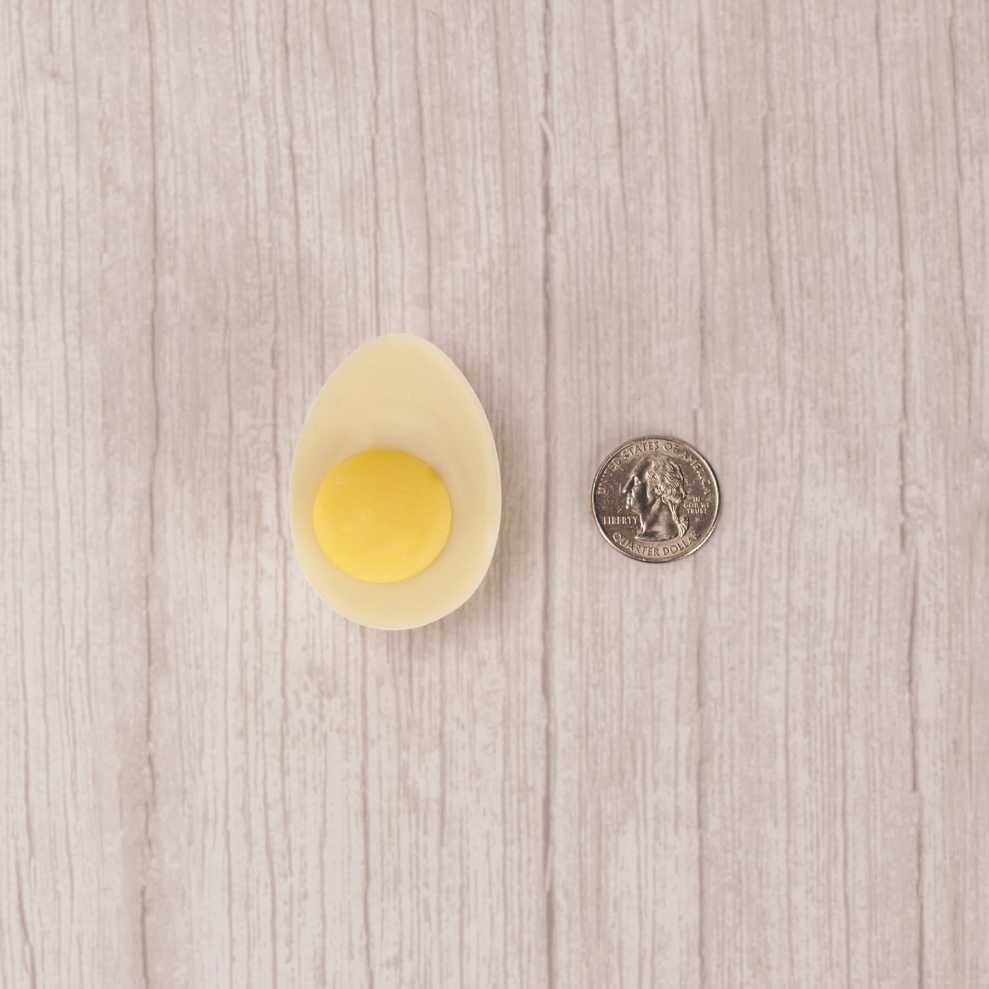 white coating with a dollop of yellow coating in the center to look like a real deviled egg!