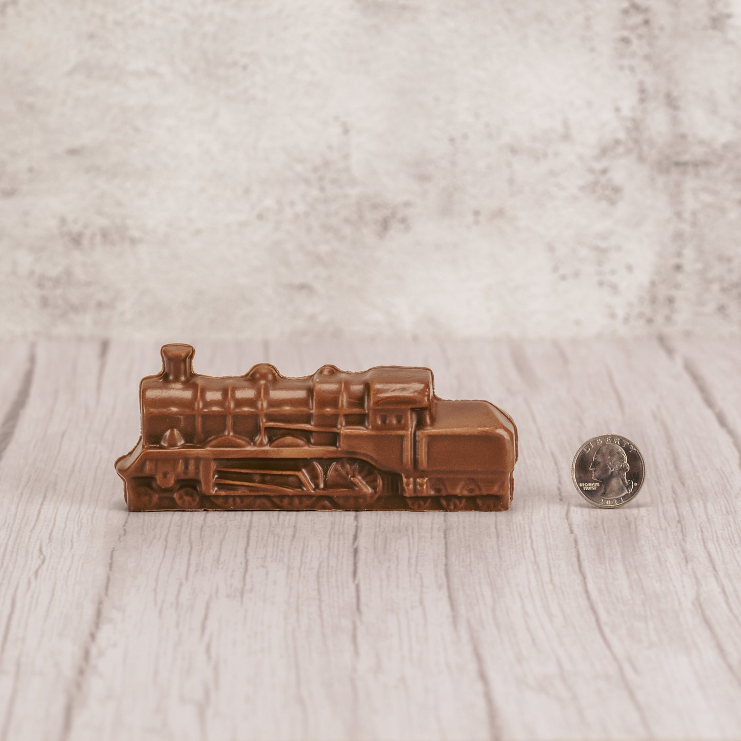 a small milk chocolate train in milk chocolate