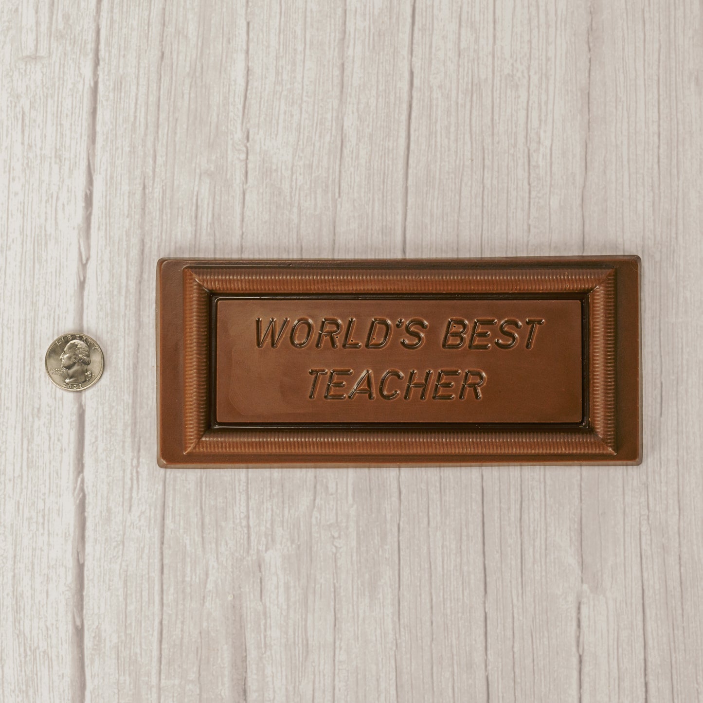 solid milk chocolate rectangle bar that reads "world's best teacher'