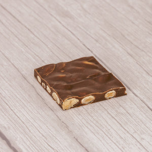 Milk chocolate with almonds. Cut into 2 inch by 2 inch squares. Approximately 16 pieces in a  pound box.