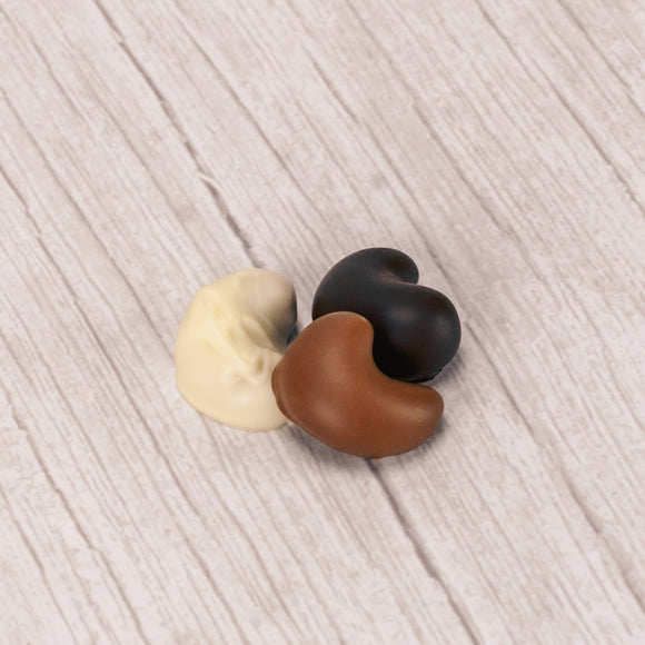 freshly roasted cashews covered in smooth milk chocolate, rich dark chocolate or sweet white coating (tastes like white chocolate) in a pound box.