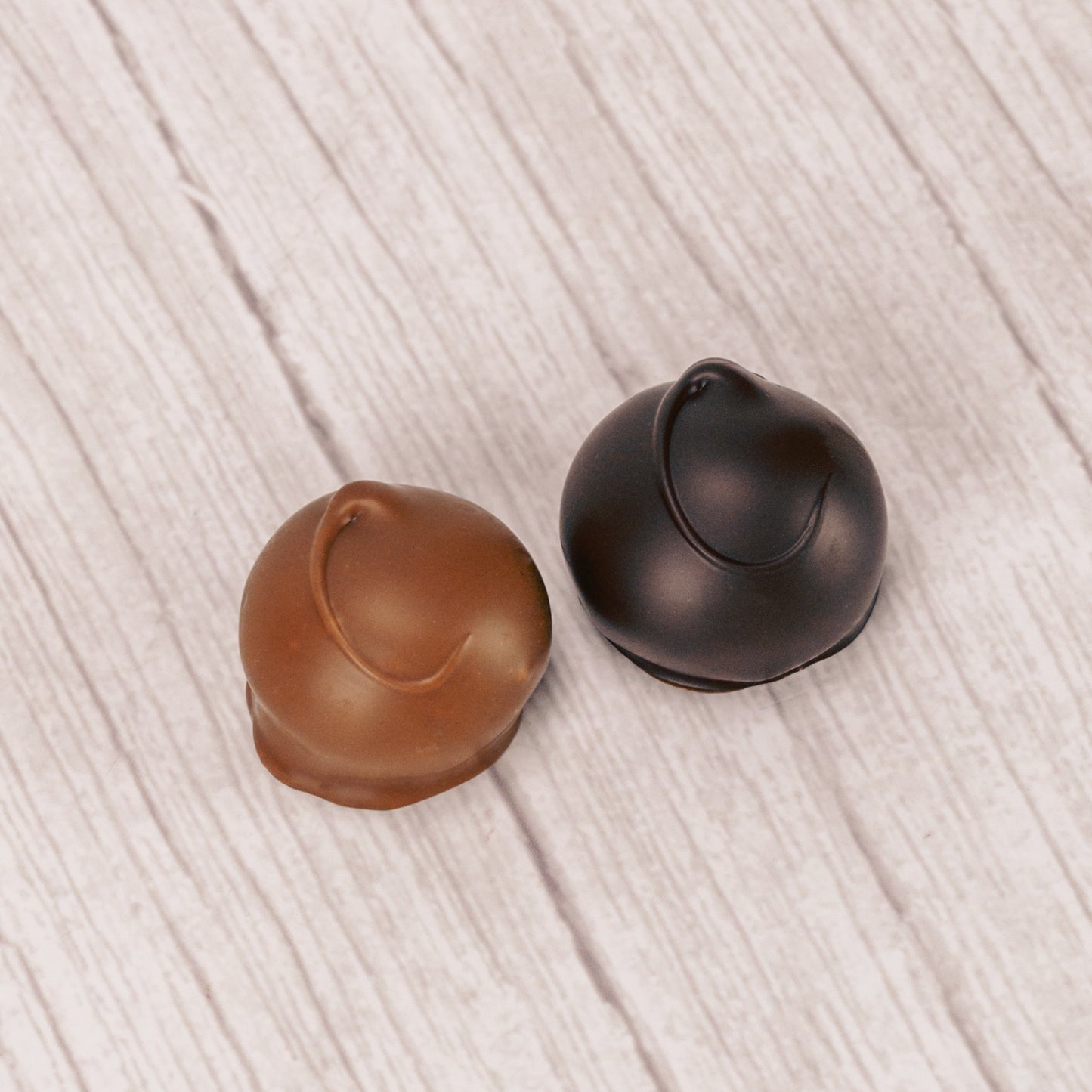 A fudgy chocolate center covered in smooth milk chocolate or rich dark chocolate. Approximately 32 pieces in a pound box.