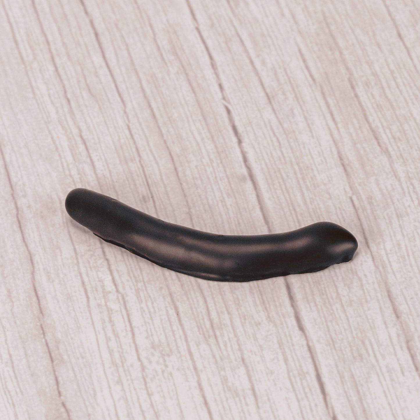candied orange peel strips covered in rich dark chocolate in a pound box.
