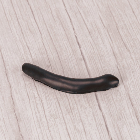 candied orange peel strips covered in rich dark chocolate in a pound box.