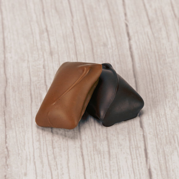 crunchy peanut butter center covered in rich dark chocolate or smooth milk chocolate in a one pound box.